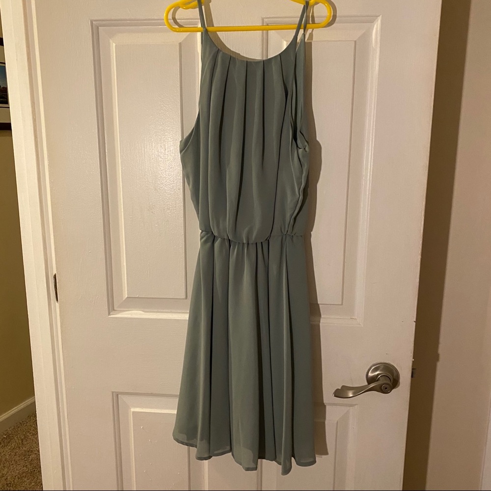Francesca’s green chiffon dress